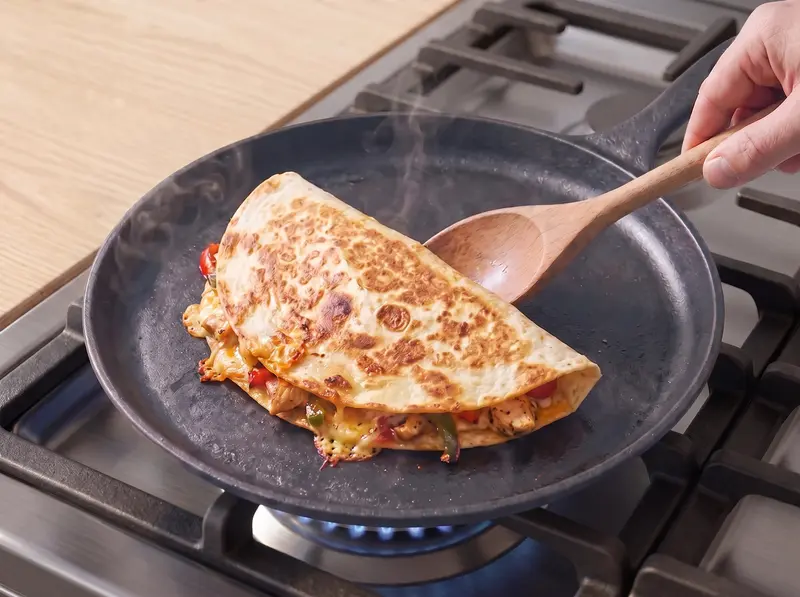 Chicken quesadilla folded and pan-fried until the underside is golden and crisp
