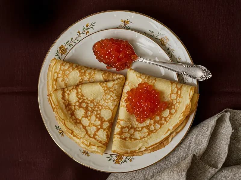 Pancakes with Caviar with butter, caviar and eggs — Russia recipe